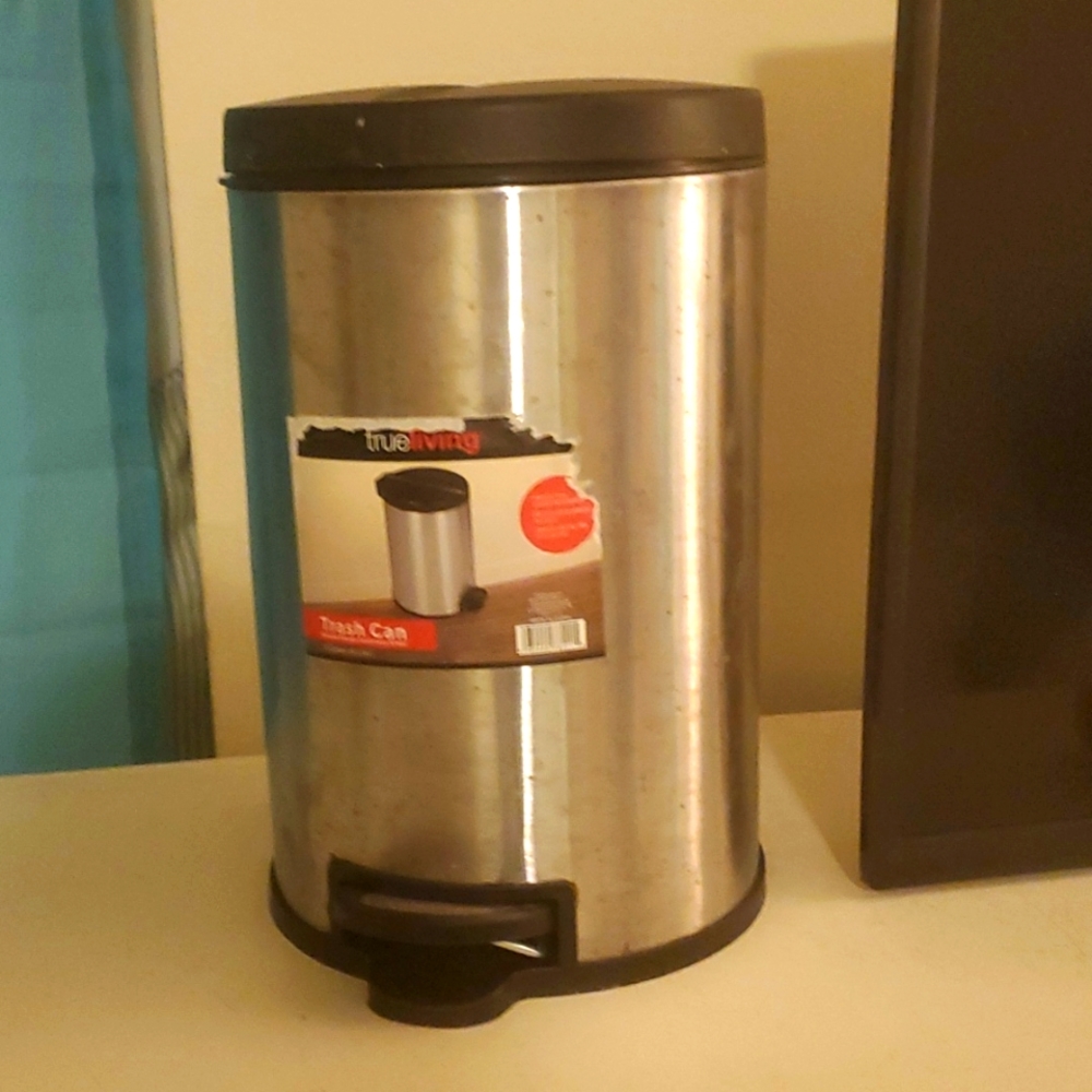 A round shaped 6 lnch stainless steel trash can